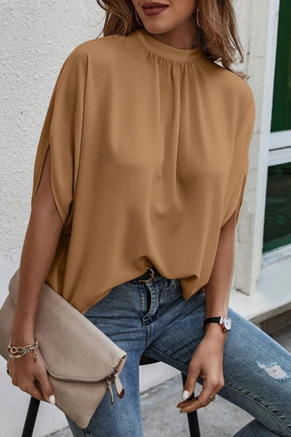 Blouse à manches mi-longues fendue au dos et nouée