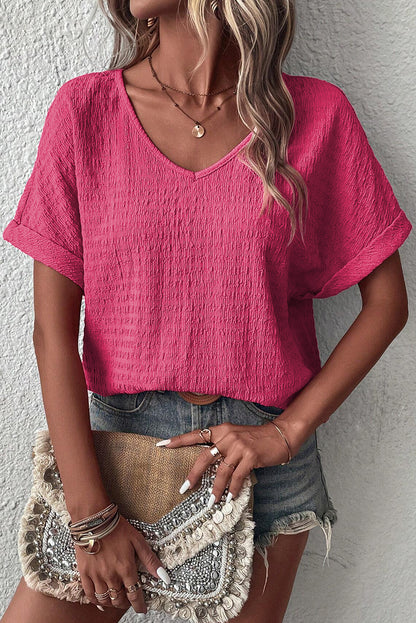 Blusa con cuello en V y manga corta enrollada con textura rosa brillante