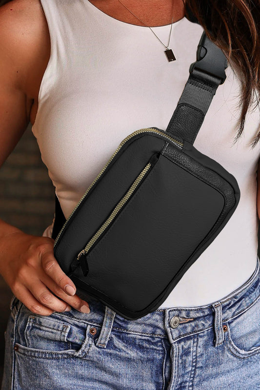 Bolso bandolera minimalista negro con varias cremalleras