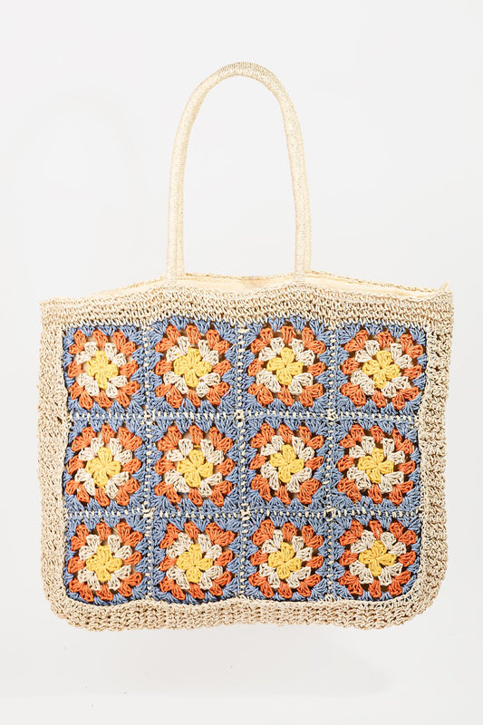 Bolso tote trenzado con flores de fama