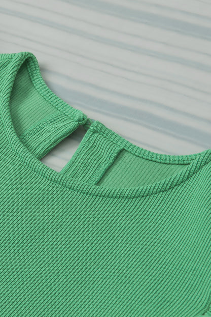 Blusa de punto acanalado con mangas abullonadas y volantes verde