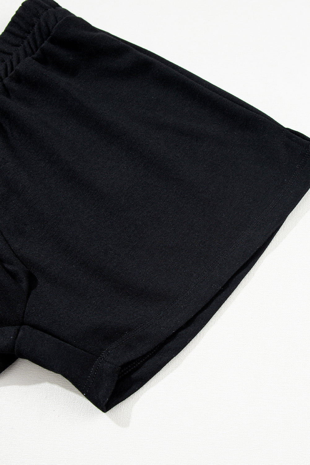 Conjunto de pantalones cortos y sudadera con capucha sin mangas de color negro liso