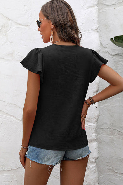 Blusa de manga acampanada plisada texturizada de color sólido negro