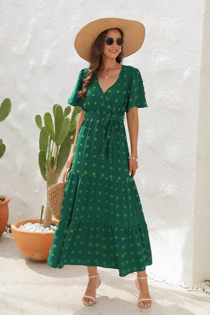 Robe à manches courtes avec surplis noué à pois suisses