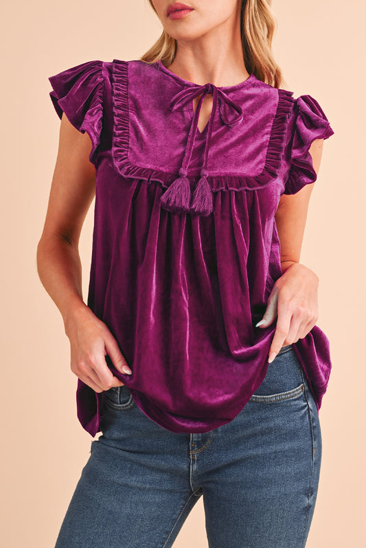 Blouse violette à manches courtes et volants à col noué