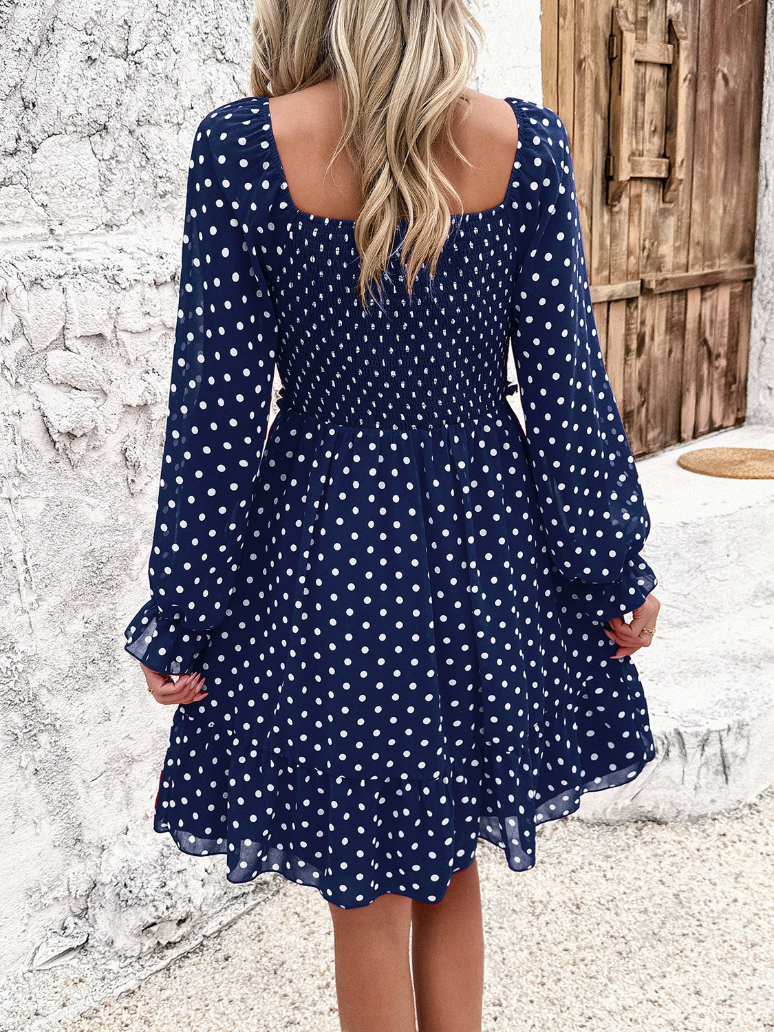 Robe smockée à pois et manches longues