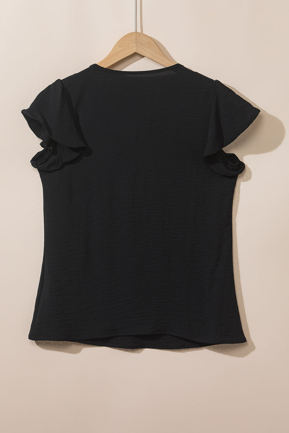 Blusa de manga acampanada plisada texturizada de color sólido negro