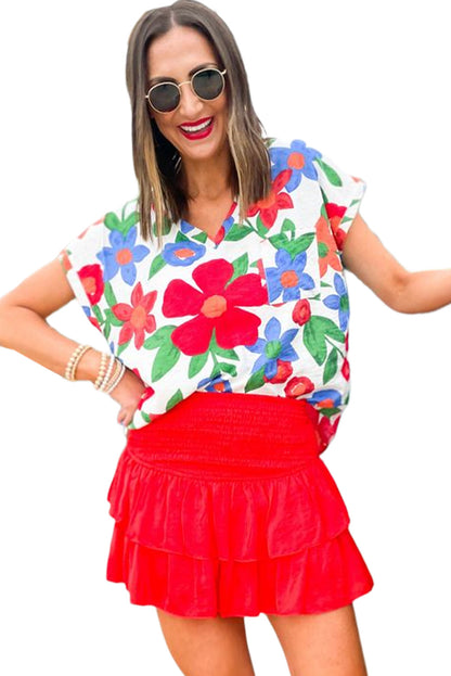 Blusa con cuello en V y bolsillo en el pecho con estampado de flores