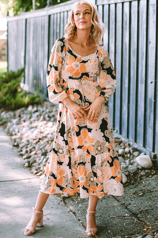 Robe longue florale audacieuse à manches bouffantes et à nouer à la taille