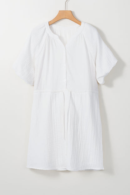 Robe chemise blanche à manches bouffantes et cordon de serrage avec poches