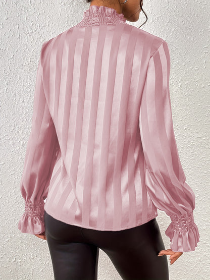 Blouse smockée à manches longues et col montant