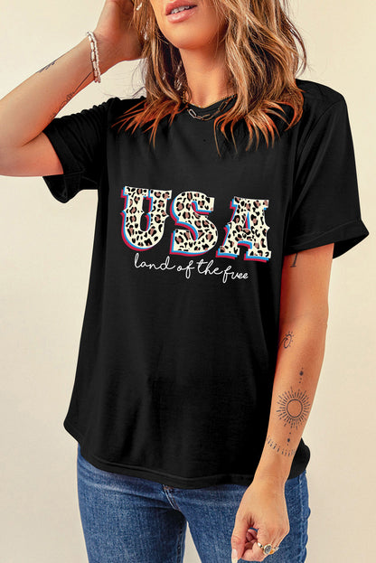 Camiseta con estampado de lema de la tierra de los Estados Unidos, leopardo negro, libre