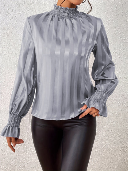 Blouse smockée à manches longues et col montant