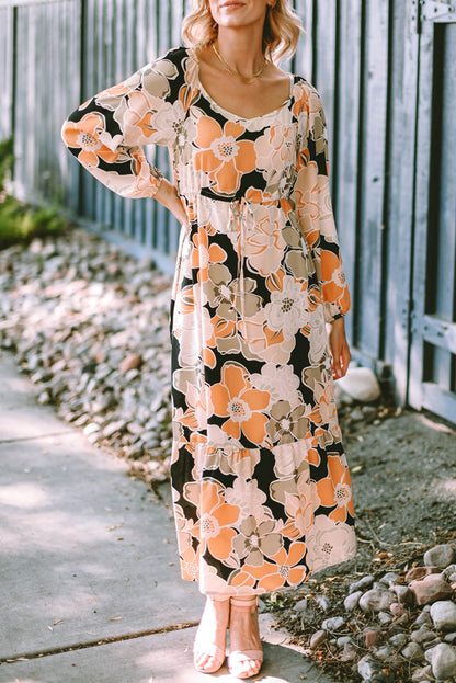 Robe longue florale audacieuse à manches bouffantes et à nouer à la taille