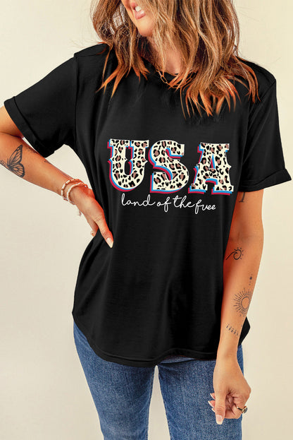 Camiseta con estampado de lema de la tierra de los Estados Unidos, leopardo negro, libre