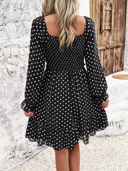 Robe smockée à pois et manches longues