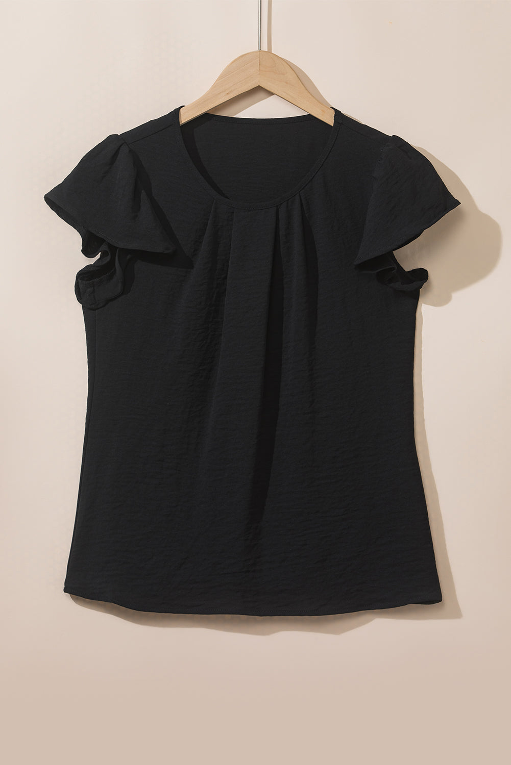 Blusa de manga acampanada plisada texturizada de color sólido negro